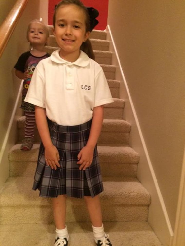 Ready for 4th grade! With photo bomb courtesy of her little sister.