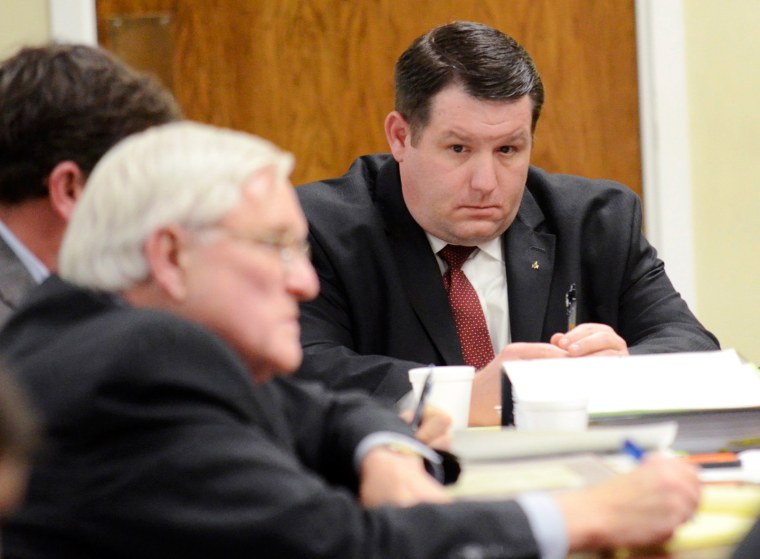 Image: Former Eutawville Police Chief Richard Combs sits with lawyers