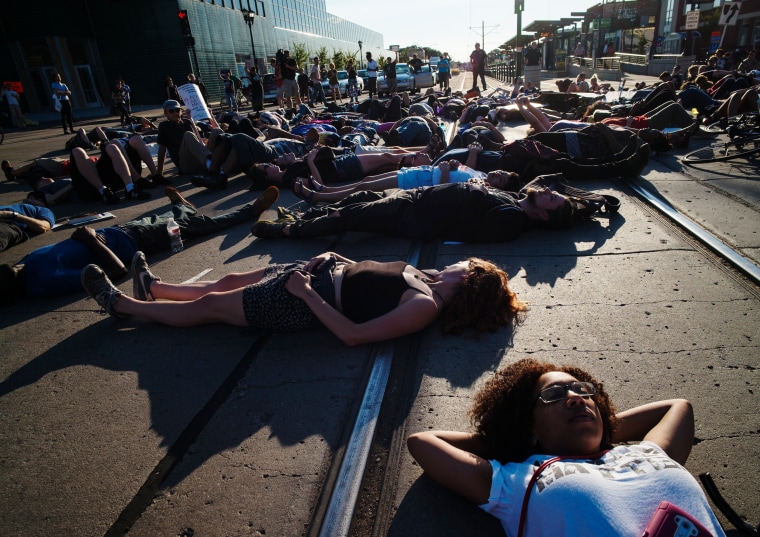 Image: People participate in a Black Lives Matter protest