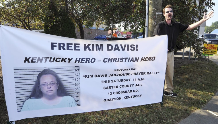 Image: David Jordan, a member of Chirst Fellowship in North Carolina, preaches in support of the prayer rally at the Carter County Detention Center for Rowan County clerk Kim Davis in Grayson