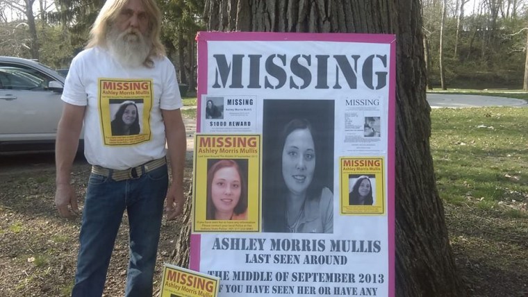 Don Morris alongside some of the posters he has created to help find his daughter Ashley.