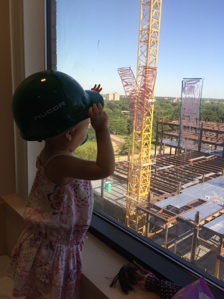 Vivian Keith, who is being treated for leukemia at St. Louis Children's Hospital, looks at the construction site outside.