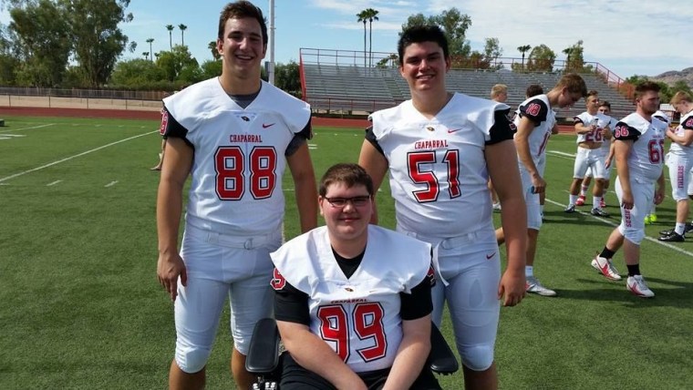 Senior football captains Christian Skeptaris and Derek Porambo with Kevin Groeger.