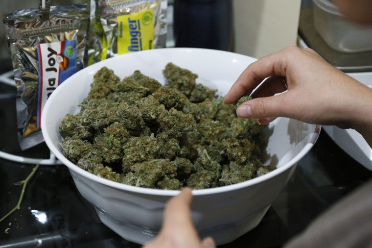 Image: Marijuana buds are prepped for sale
