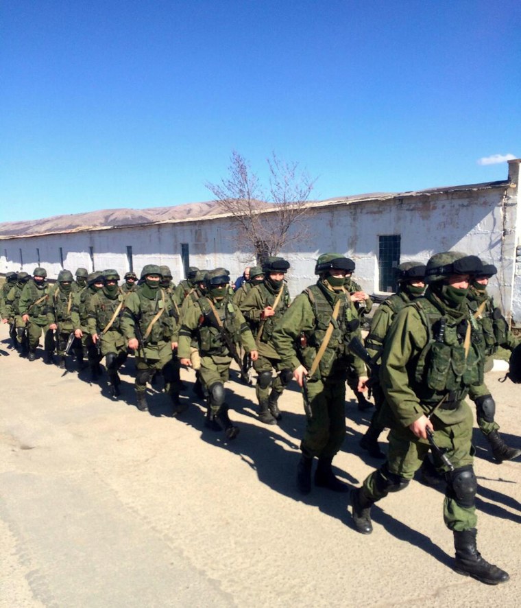 Image: Russian troops during shift change outside Privolnoye military base in Crimea, Ukraine.