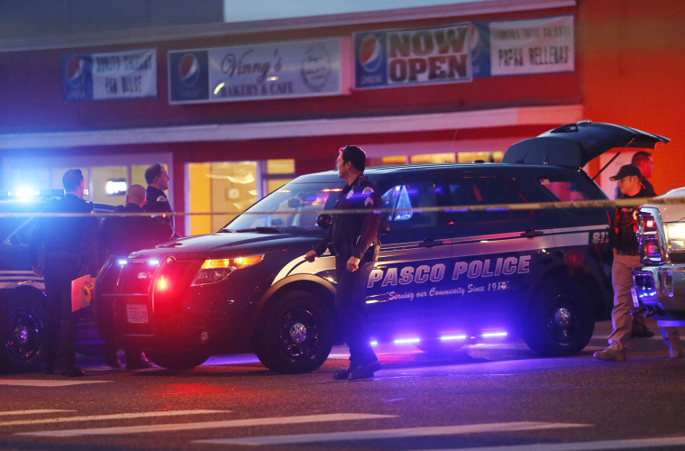 Pasco Police officers investigate the scene on Feb. 10, 2015 of the shooting of Antonio Zambrano-Montes, in Pasco, Wash.