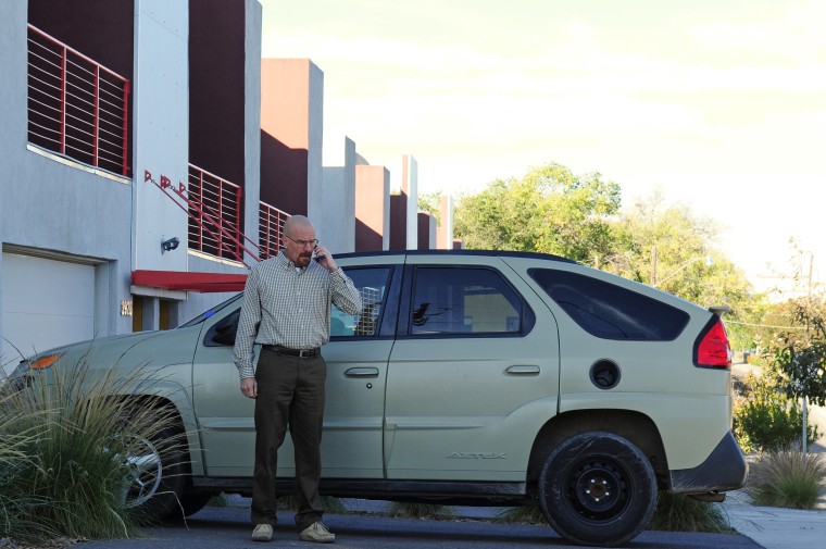 Bryan Cranston as Walter White stands in front of his Pontiac Aztek in "Breaking Bad."