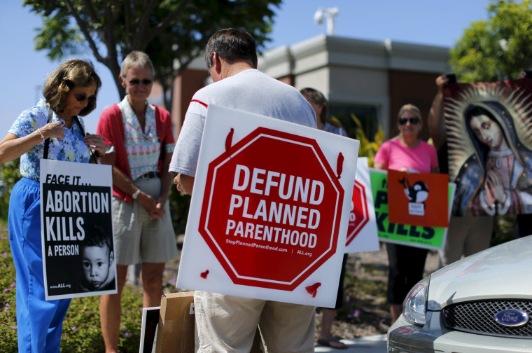 Image: Protesters gather outside a Planned Parenthood clinic in Vista, California