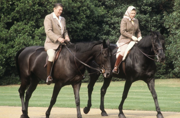 Queen Elizabeth II and President Ronald Reagan riding through the grounds of Windsor Castle