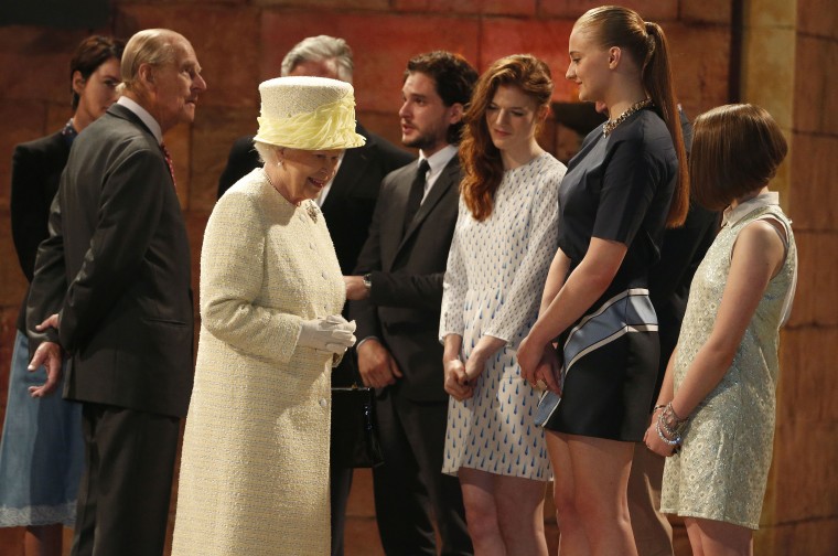 Britain's Queen Elizabeth and Prince Philip talk with members of Game of Thrones Cast