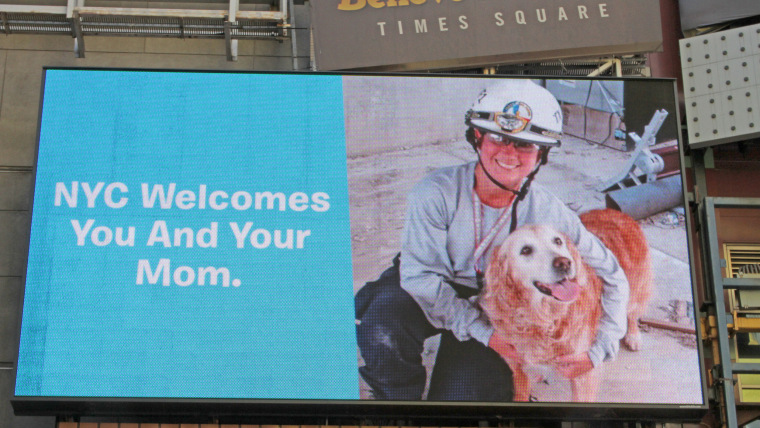 Billboard in Times Square honoring Bretagne the dog and her handler, Denise Corliss