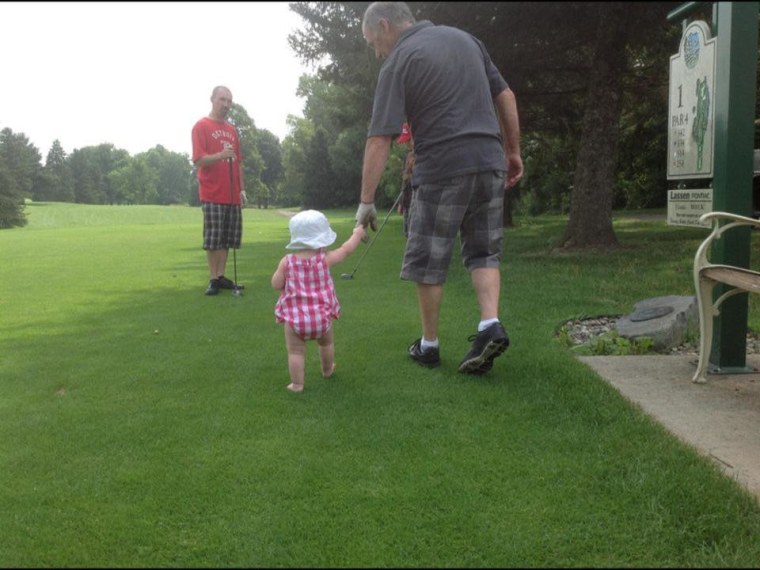 My daughter golfing with Grandpa who she calls "Baca"...Grandma is "Monga". She came up with those on her own.