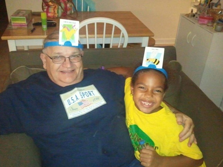 Corrina playing Headbandz with her Pappy Spade.