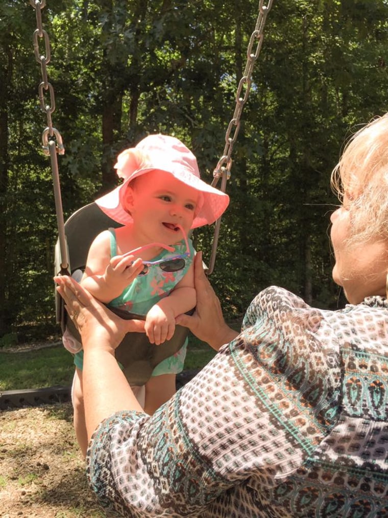 Mia enjoying the swings with her Layla (taken from the Spanish word abuela).