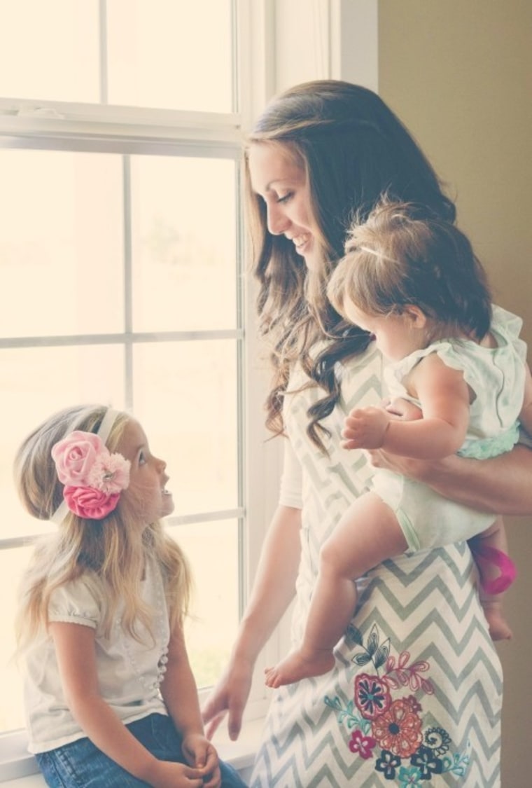 Mom with daughters near window