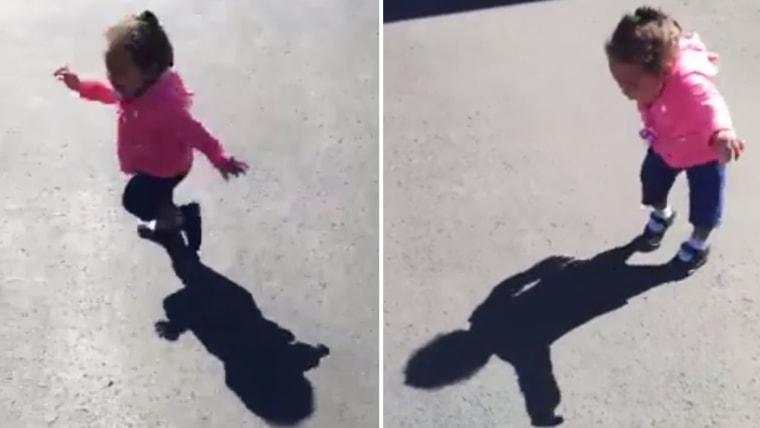 Little girl afraid of her own shadow