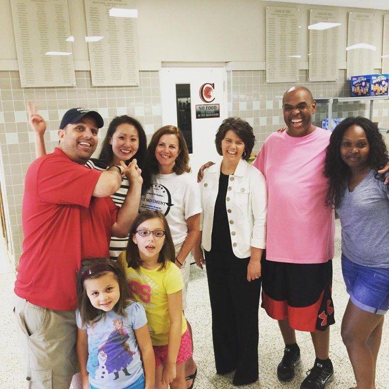 Lindy Li (2nd from l.) with members of the community at Coatesville Area High School, in Chester County, Pennsylvania.