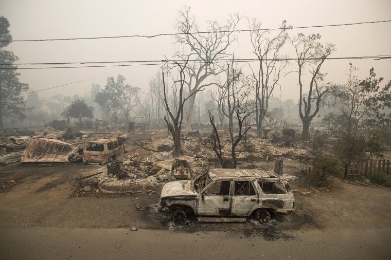 Image: Burned out remains of vehicles and homes scorched by the Valley Fire line Wardlaw St. in Middletown