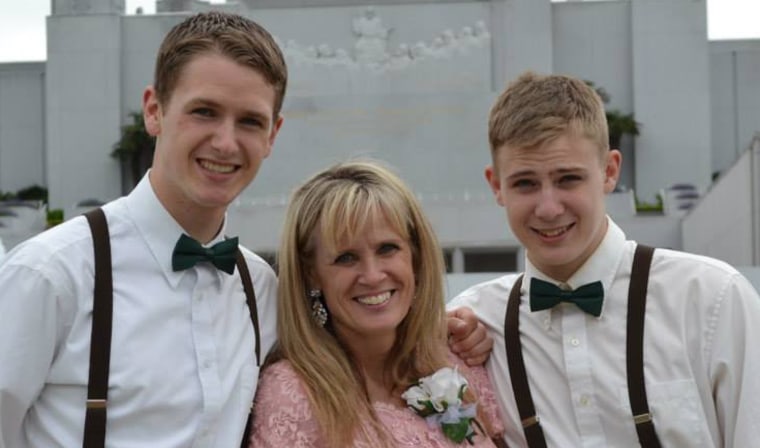 Tracey Smith (center) with her son Macin (right) and older brother (left) at a family wedding in May.