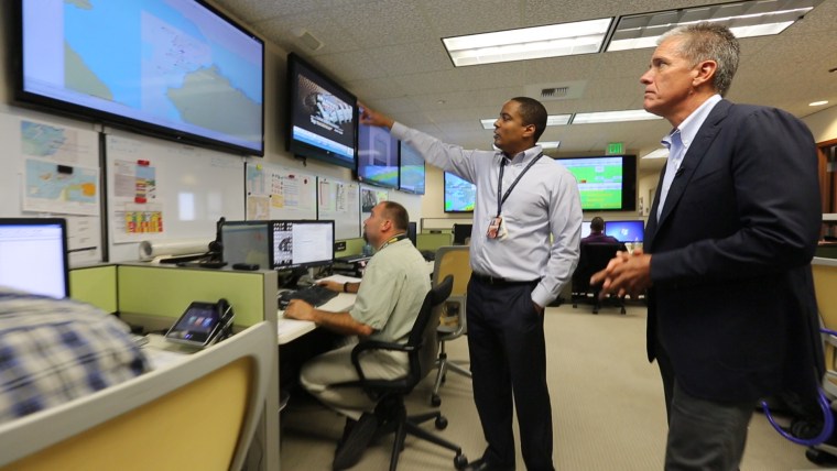 Royal Dutch Shell President Marvin Odum, right, at his company’s Anchorage operations center.
