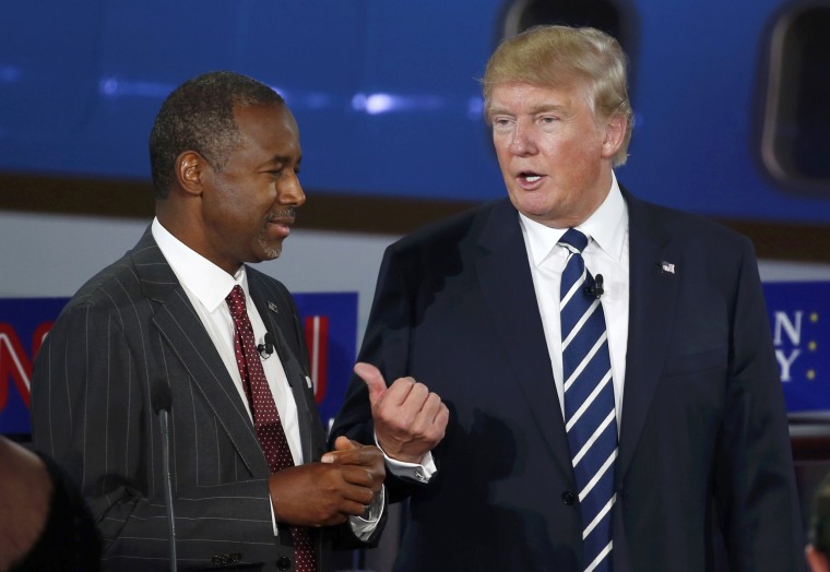 Image: Republican U.S. presidential candidates Carson and Trump talk during a break at the second official Republican presidential candidates debate of the 2016 U.S. presidential campaign at the Ronald Reagan Presidential Library in Simi Valley