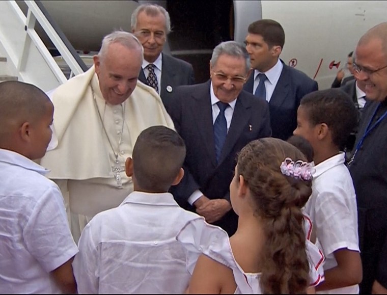 Pope Francis is greeted by children as he arrives in Cuba on Sept. 19.