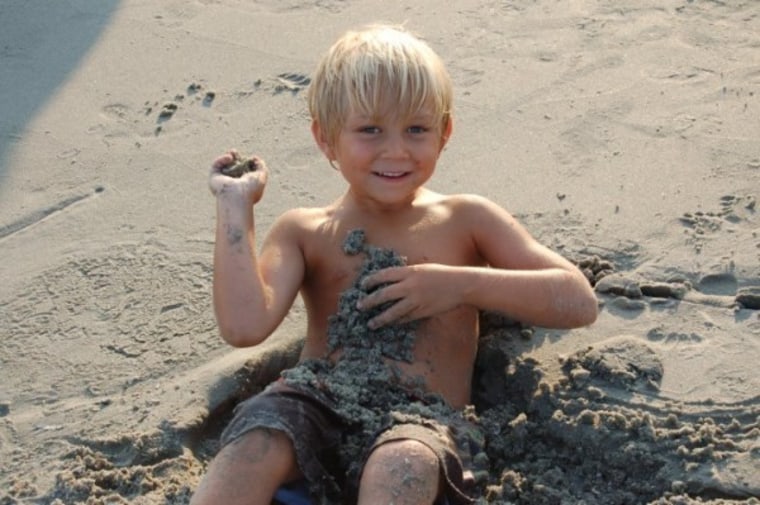 Boy playing in sand