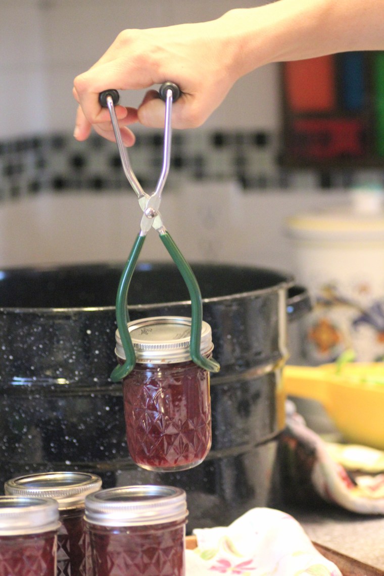 Putting jars in a water bath for canning