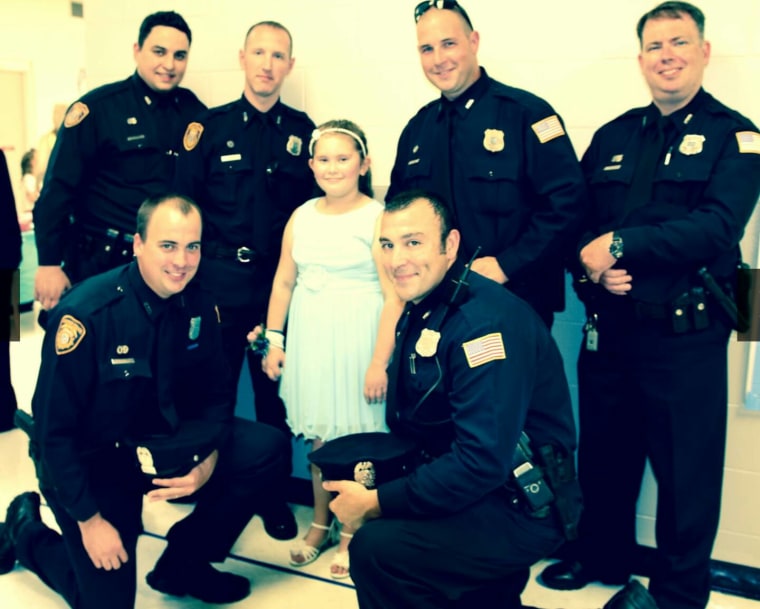 Jewel Warren attended a father-daughter dance with 6 police officers