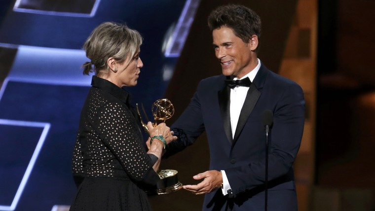 Image: McDormand accepts the award for Outstanding Lead Actress In A Limited Series Or A Movie for HBO's "Olive Kitteridge" from presenter Lowe at the 67th Primetime Emmy Awards in Los Angeles