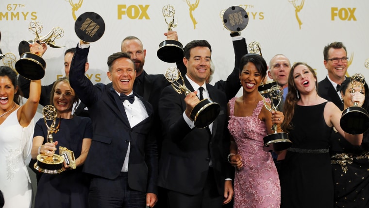 Image: Producers and crew of "The Voice" pose with their awards during the 67th Primetime Emmy Awards in Los Angeles