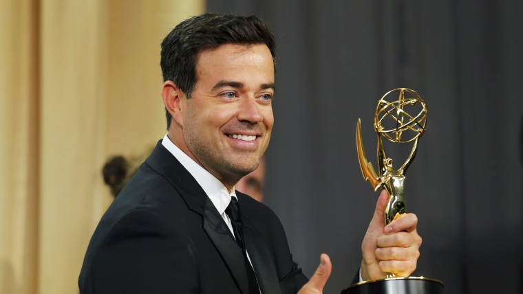 Image: Carson Daly holds the award for Outstanding Reality-Competition Program during the 67th Primetime Emmy Awards in Los Angeles