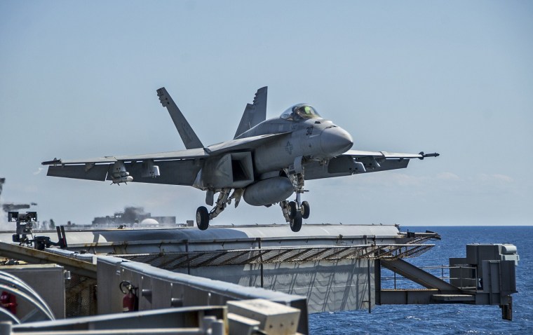 Image: A handout file photo of an F/A-18E Super Hornet being launched from the flight deck of the USS George Washington in the Pacific.