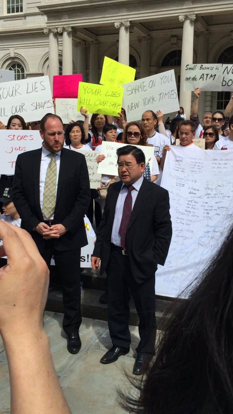 City councilmembers David G. Greenfield (l.) of Brooklyn and Peter Koo of Queens at Monday’s rally in New York City.