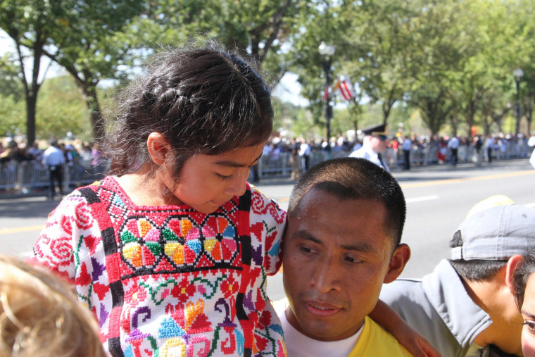 Raul Cruz holds his daughter Sophie.