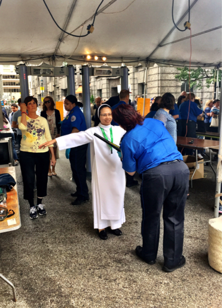 Image: A nun being checked by a TSA agent in Philadelphia early Saturday.