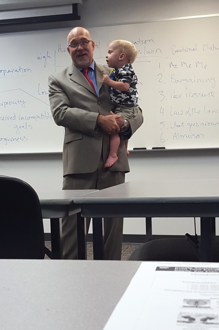 Professor holds toddler