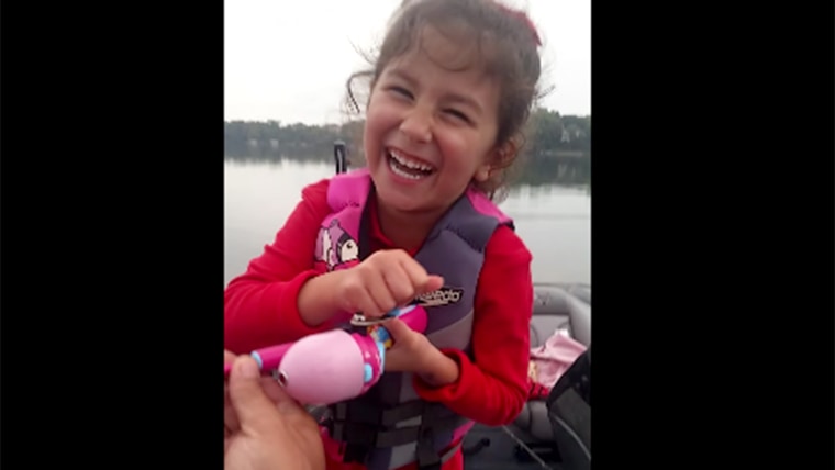 Little girl catches huge bass with a Barbie fishing pole