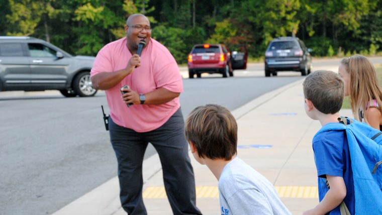 Principal welcomes students back with dancing