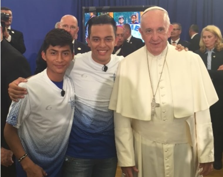 Lazaro Us Baquiax (17), left, and Ariel Mejia (18) with Pope Francis in Harlem.