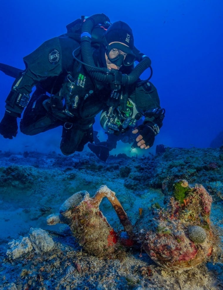 Image: Archaeologist swims over artifacts at site of Antikythera shipwreck