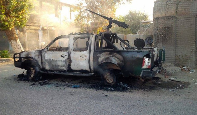 Image: Burnt-out truck in Kunduz on Thursday