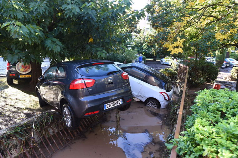 Image: Damaged cars are seen in a parking lot in Mandelieu-la-Napoul