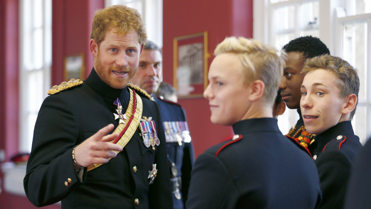 Image: Britain's Prince Harry talks to students at an informal reception during his visit to The Duke of York's Royal Military School in Dover,
