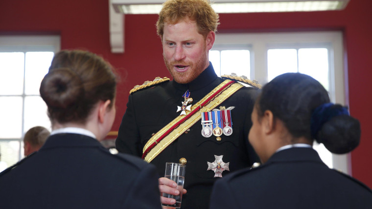 Image: Britain's Prince Harry talks to students at an informal reception during his visit to The Duke of York's Royal Military School in Dover,
