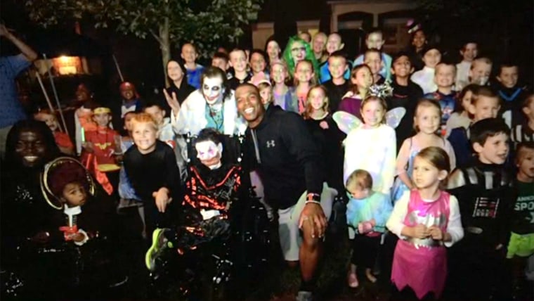 Cam Newton surprised a boy with cancer at an early Halloween party