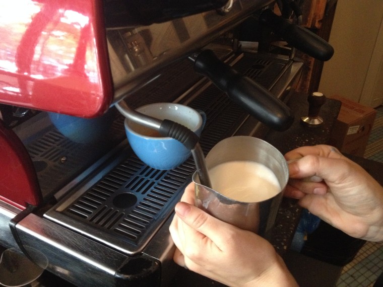 Froth warm milk for the latte