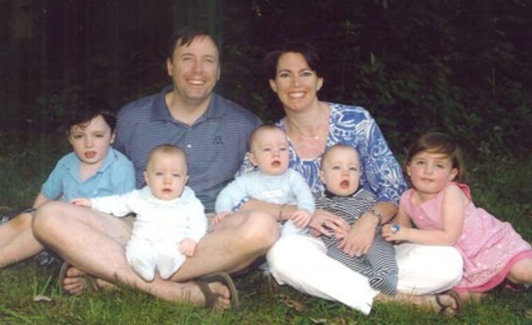 Parents pictured with five children under 5