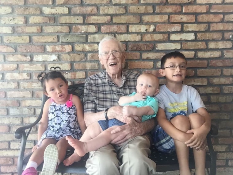 Katie Dains shared this photo of a great-grandfather with his three great-grandchildren.