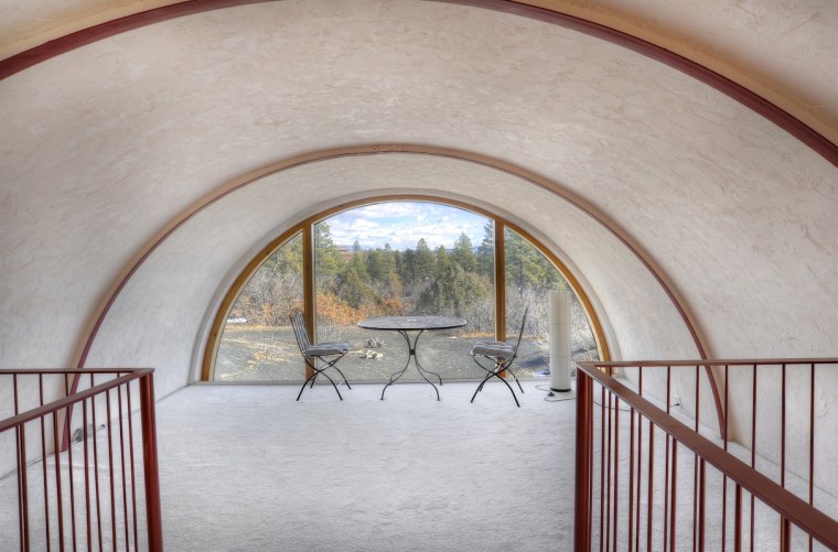 An asterisk-shaped home with an Anasazi-style tower